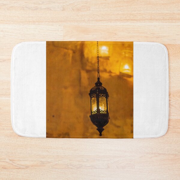Item preview, Vintage Hanging Lantern With Warm Amber Light Against a Stone Wall Interior designed and sold by Nmallia.