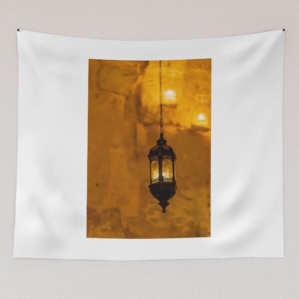 Item preview, Vintage Hanging Lantern With Warm Amber Light Against a Stone Wall Interior designed and sold by Nmallia.