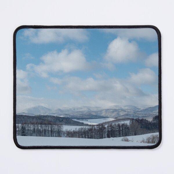 Item preview, Snow-Covered Rolling Hills and Forest Beneath a Cloudy Blue Sky designed and sold by seunghus.
