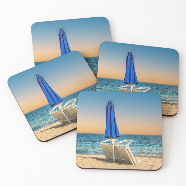 Item preview, A peaceful beach scene with two empty chairs beneath an umbrella designed and sold by Craig Bernstein.