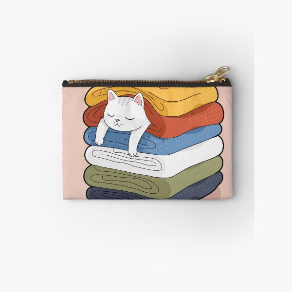 Item preview, Cozy White Cat Sleeping In Warm Folded Laundry Pile Cute Graphic Art designed and sold by The Upside Down.