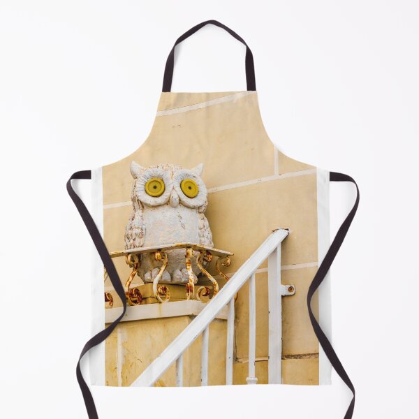 Item preview, Whimsical Stone Owl Statue With Yellow Eyes Guarding Rusty Railing Above Beige Wall designed and sold by Nmallia.