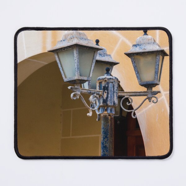 Item preview, Vintage Street Lamp Post With Three Lanterns Against a Warm Stone Archway Setting designed and sold by Nmallia.