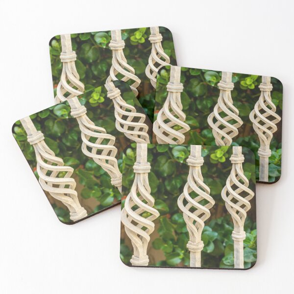 Item preview, Decorative Twisted Iron Fence Bars With Vertical Rods Over Lush Green Hedge Behind Wall designed and sold by Nmallia.