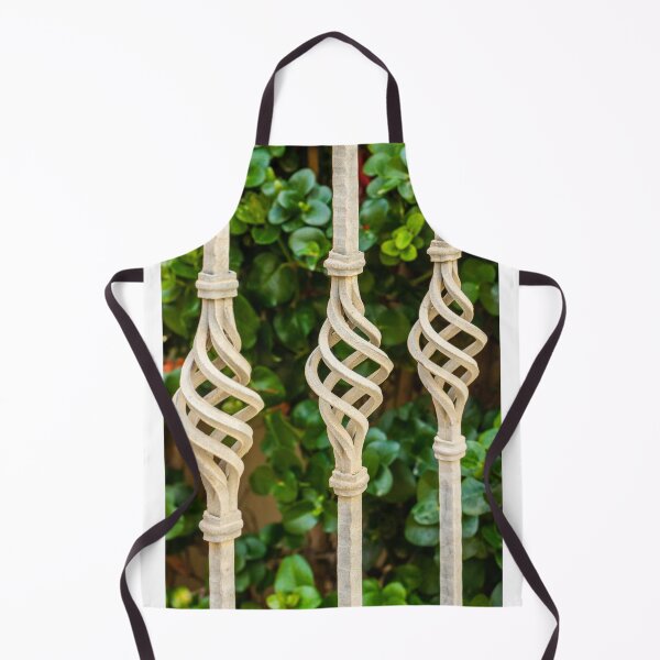 Item preview, Decorative Twisted Iron Fence Bars With Vertical Rods Over Lush Green Hedge Behind Wall designed and sold by Nmallia.