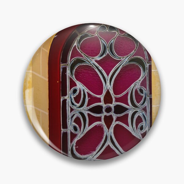Item preview, Elegant Arched Stained Glass Window With Intricate Ironwork On Warm Stone Facade designed and sold by Nmallia.