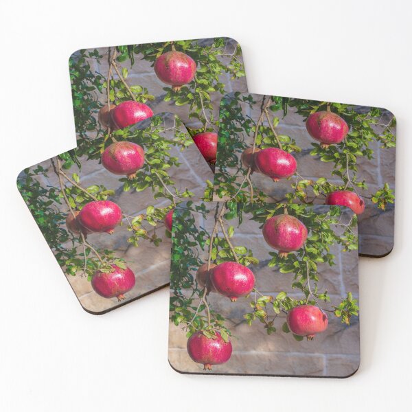 Item preview, Vibrant Red Pomegranate Hanging From Lush Green Tree Branches in a Sunlit Orchard designed and sold by Nmallia.