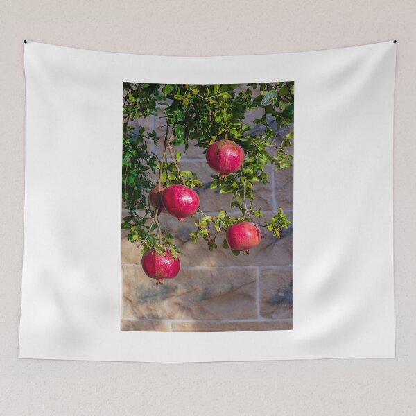 Item preview, Vibrant Red Pomegranate Hanging From Lush Green Tree Branches in a Sunlit Orchard designed and sold by Nmallia.