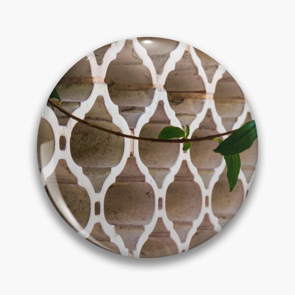Item preview, Vines Climb Through White Lattice Fence Against Aged Brick Wall In Sunlight designed and sold by Nmallia.