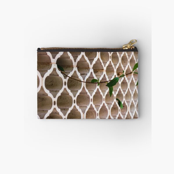 Item preview, Vines Climb Through White Lattice Fence Against Aged Brick Wall In Sunlight designed and sold by Nmallia.