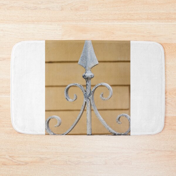 Item preview, Decorative Wrought Iron Fence Finial With Scrollwork And Spear Tops Against Yellow Wall designed and sold by Nmallia.