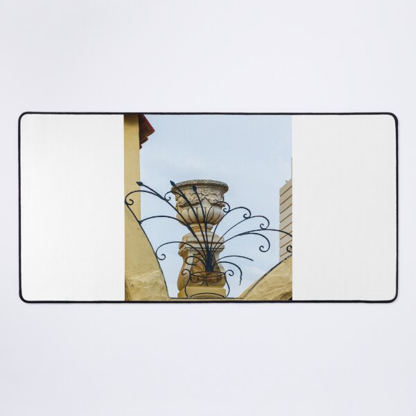 Item preview, Ornate Black Iron Fencing Surrounding a Stone Urn On a Sunlit Mediterranean Roofline designed and sold by Nmallia.