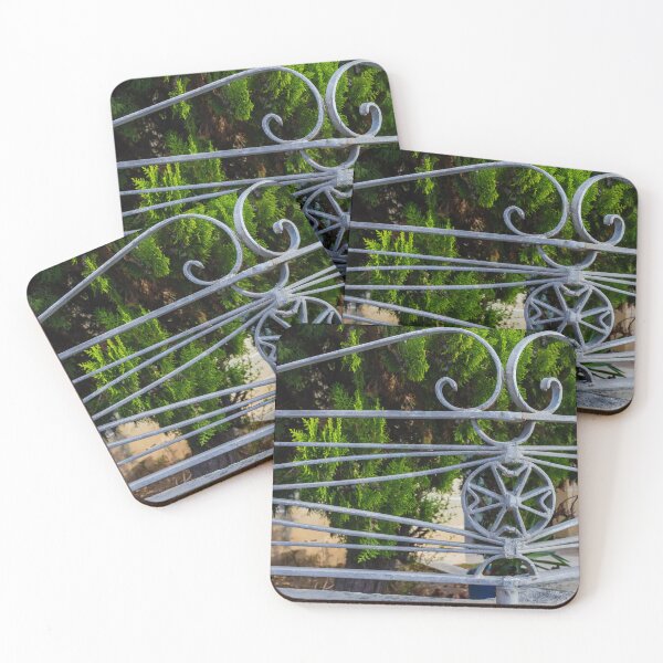 Item preview, Ornate Wrought Iron Gate Railings With Star Medallion Against Lush Greenery designed and sold by Nmallia.