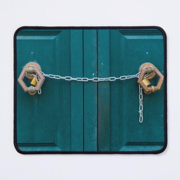 Item preview, Teal Double Doors Secured With Chains And Padlocks Across Panels Of A Metal Gate designed and sold by Nmallia.