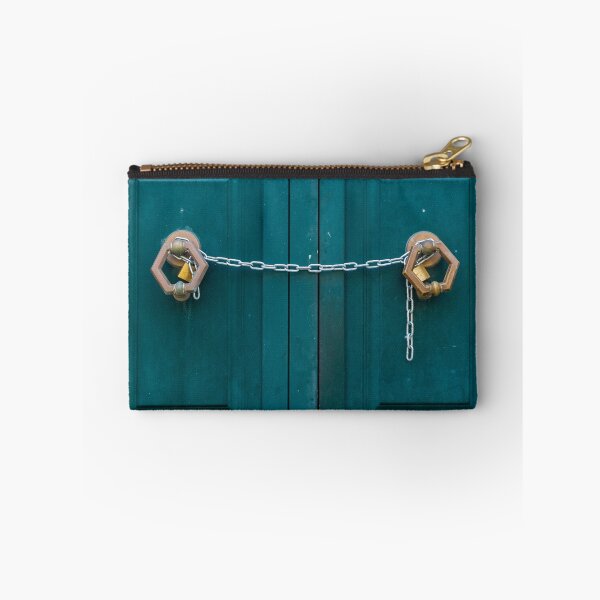 Item preview, Teal Double Doors Secured With Chains And Padlocks Across Panels Of A Metal Gate designed and sold by Nmallia.