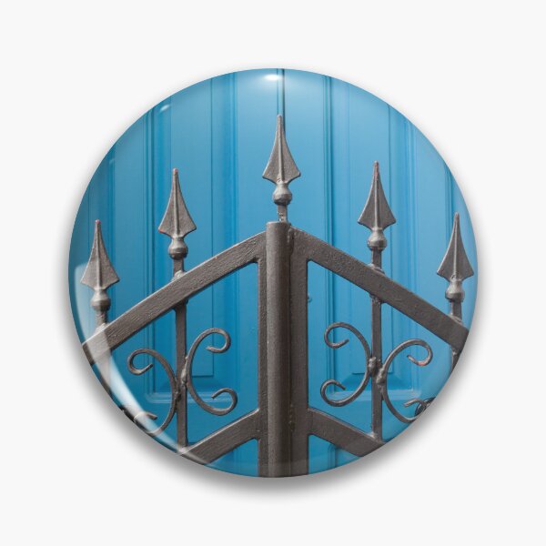 Item preview, Bold Blue Doors Behind Ornate Black Iron Fence Create Striking Street Scene designed and sold by Nmallia.