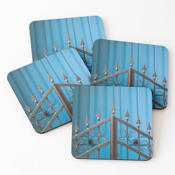 Item preview, Bold Blue Doors Behind Ornate Black Iron Fence Create Striking Street Scene designed and sold by Nmallia.