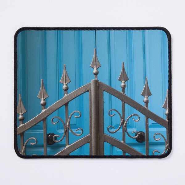 Item preview, Bold Blue Doors Behind Ornate Black Iron Fence Create Striking Street Scene designed and sold by Nmallia.