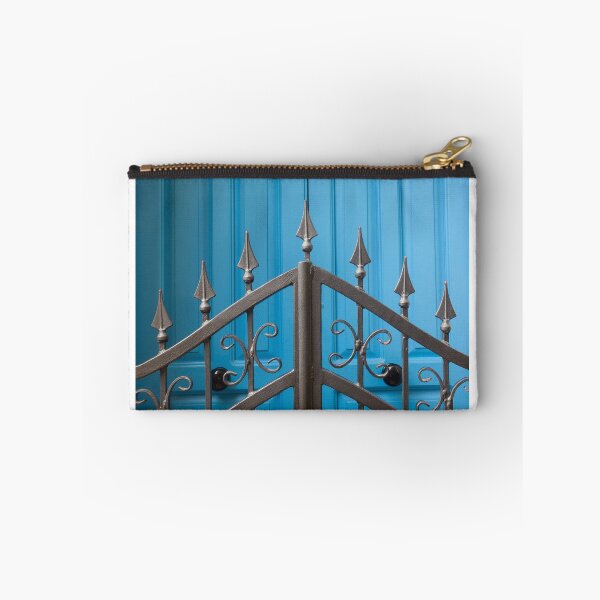 Item preview, Bold Blue Doors Behind Ornate Black Iron Fence Create Striking Street Scene designed and sold by Nmallia.