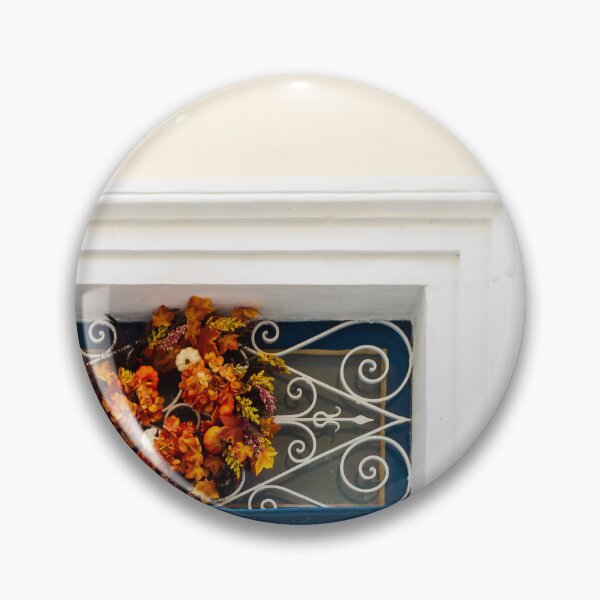 Item preview, Autumn Wreath Adorns Blue Door With White Ornate Grille On Sunlit Wall designed and sold by Nmallia.