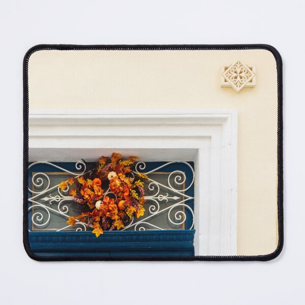 Item preview, Autumn Wreath Adorns Blue Door With White Ornate Grille On Sunlit Wall designed and sold by Nmallia.