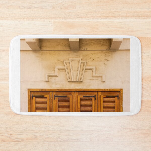 Item preview, Art Deco Stone Motif Above Warm Wooden Shuttered Door on Cream Facade, Historic Urban Architecture Detail designed and sold by Nmallia.