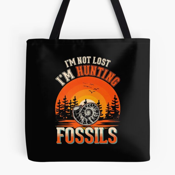 Item preview, Retro Ammonite Fossil Hunting Sunset Graphic designed and sold by ballyyksjod.