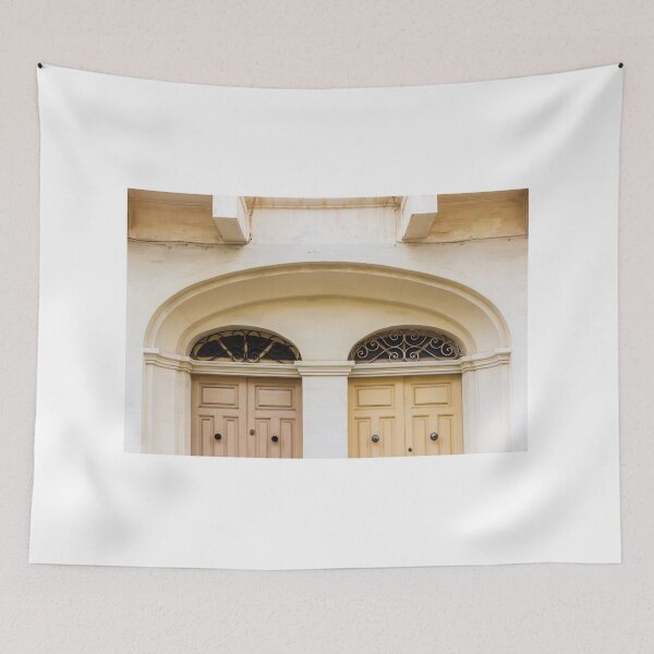 Item preview, Double Wooden Doors Under Archway With Decorative Iron Grilles On Cream Facade designed and sold by Nmallia.