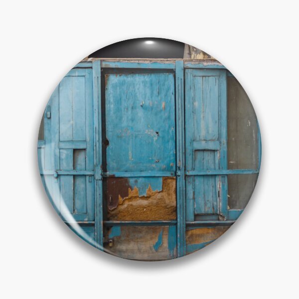 Item preview, Weathered Blue Wooden Doors Under Arched Entrance on Crumbling Historic City Façade designed and sold by Nmallia.