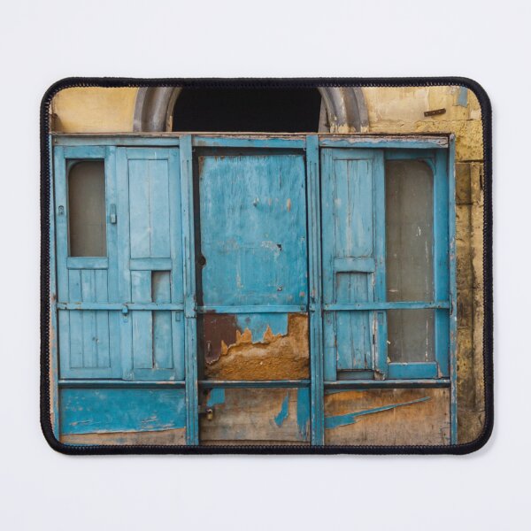 Item preview, Weathered Blue Wooden Doors Under Arched Entrance on Crumbling Historic City Façade designed and sold by Nmallia.