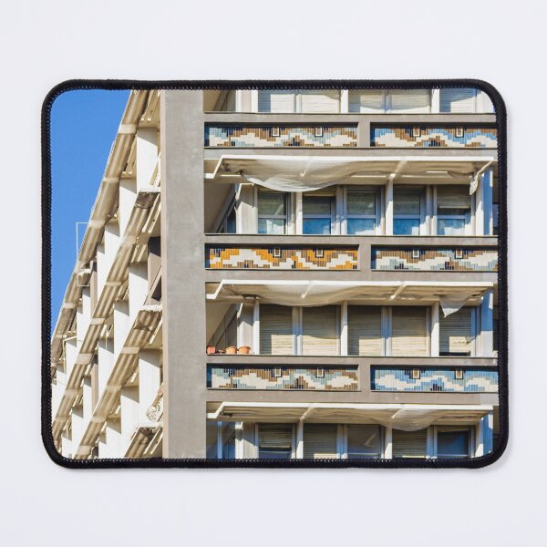 Item preview, Modern Residential Building With Colorful Balcony Tiles And White Sun Shades Under Blue Sky designed and sold by Nmallia.