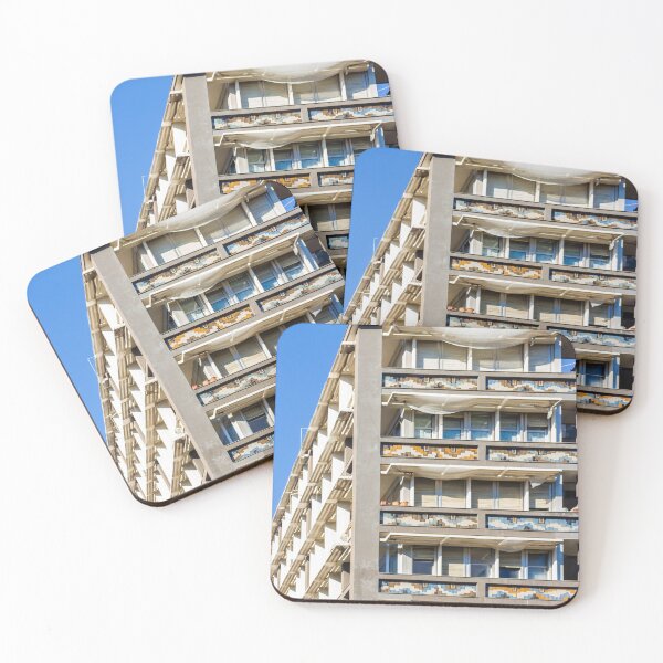 Item preview, Modern Residential Building With Colorful Balcony Tiles And White Sun Shades Under Blue Sky designed and sold by Nmallia.