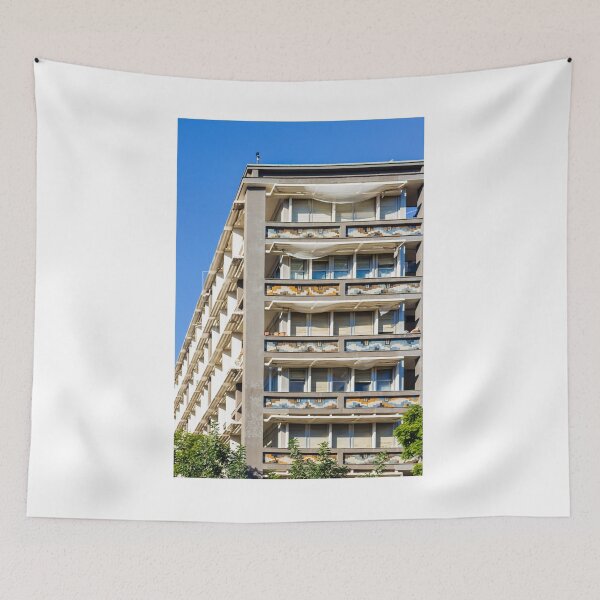 Item preview, Modern Residential Building With Colorful Balcony Tiles And White Sun Shades Under Blue Sky designed and sold by Nmallia.