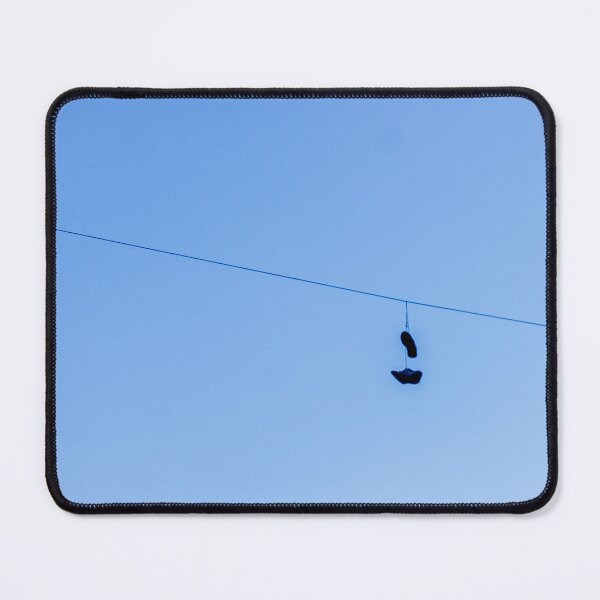 Item preview, Shoes Hanging on a Wire Against a Clear Blue Sky in Open Air designed and sold by Nmallia.