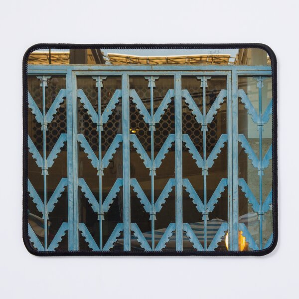 Item preview, Blue Metal Security Gate With Zigzag Pattern In Front Of Glass Window designed and sold by Nmallia.