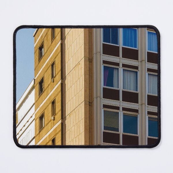 Item preview, Modern Office Building Facade With Grid Windows And Sandstone Exterior Under Clear Blue Sky designed and sold by Nmallia.
