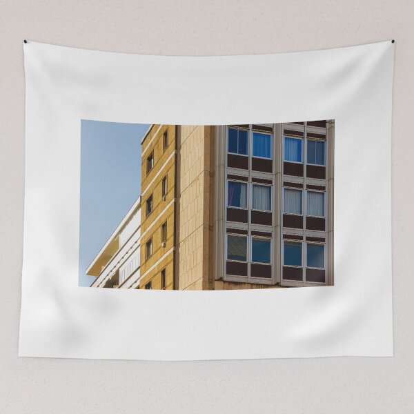Item preview, Modern Office Building Facade With Grid Windows And Sandstone Exterior Under Clear Blue Sky designed and sold by Nmallia.