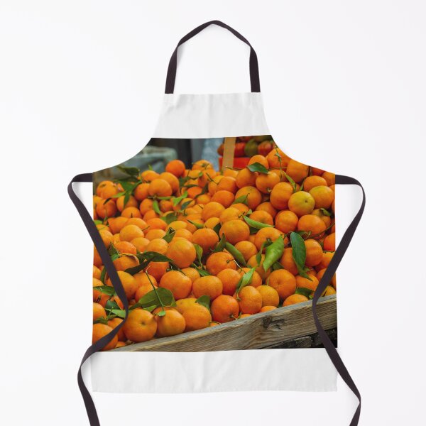 Item preview, Fresh Oranges Piled in a Wooden Crate at Market With Bright Green Leaves designed and sold by Nmallia.