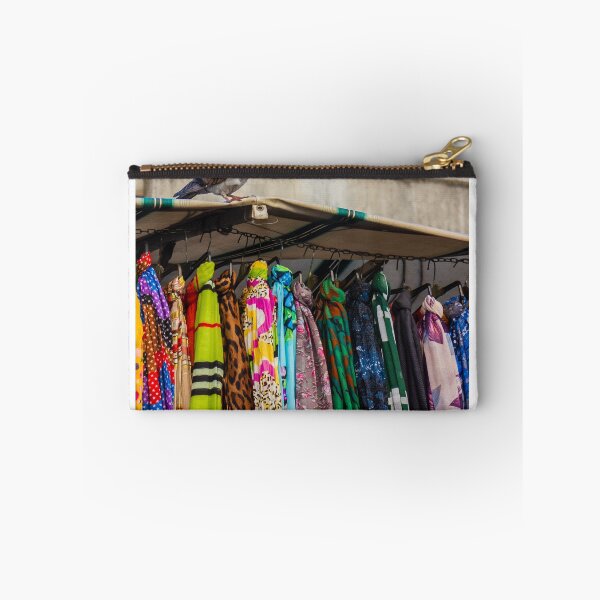 Item preview, Pigeon Perches On Market Stall Roof Above Vibrant Colorful Scarves And Fabrics designed and sold by Nmallia.
