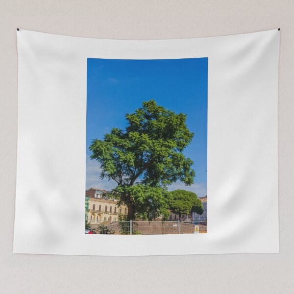 Item preview, Vibrant Green Tree Silhouette Against Clear Blue Sky Over Urban Park Scene During Sunny Day designed and sold by Nmallia.