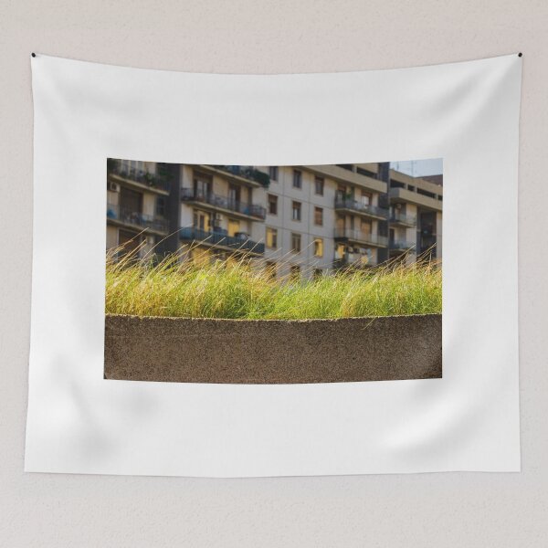Item preview, Lush Grass On Concrete Wall With Urban Apartment Building Backdrop At Dusk designed and sold by Nmallia.