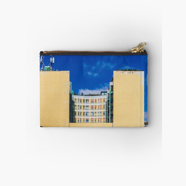 Item preview, Edificio amarillo con fachada central curva y antenas en la azotea bajo un cielo azul brillante. designed and sold by Nmallia.