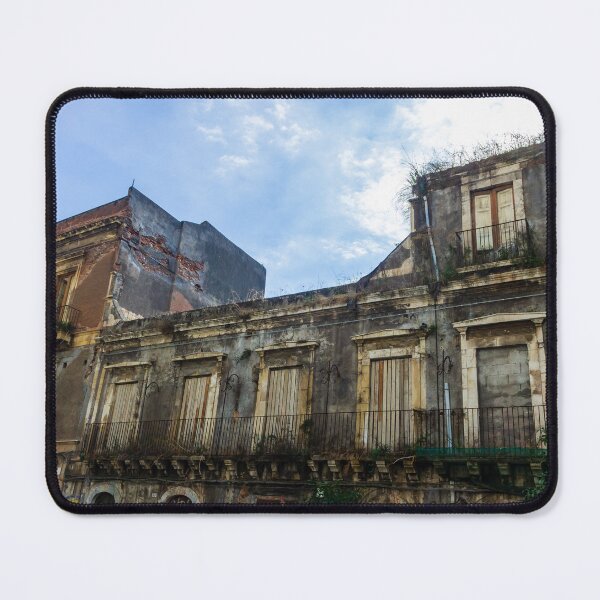 Item preview, Abandoned Historic Building With Crumbling Facade And Graffiti In Urban Street Scene designed and sold by Nmallia.