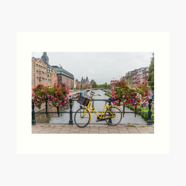 Yellow Bicycle and Flowers on a Bridge in Amsterdam Netherlands Art Print