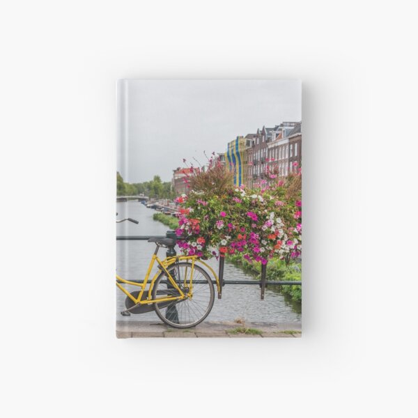 Yellow Bicycle and Flowers on a Bridge in Amsterdam Netherlands Hardcover Journal