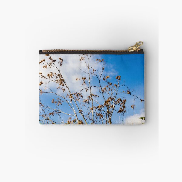 Item preview, Bare Trees Silhouetted Against Bright Blue Sky With Dry Branches and Grassy Foreground designed and sold by Nmallia.
