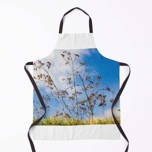 Item preview, Bare Trees Silhouetted Against Bright Blue Sky With Dry Branches and Grassy Foreground designed and sold by Nmallia.