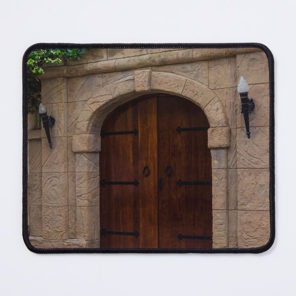 Item preview, Ancient Stone Archway With Wooden Doors And Green Vines Above A Street designed and sold by Nmallia.