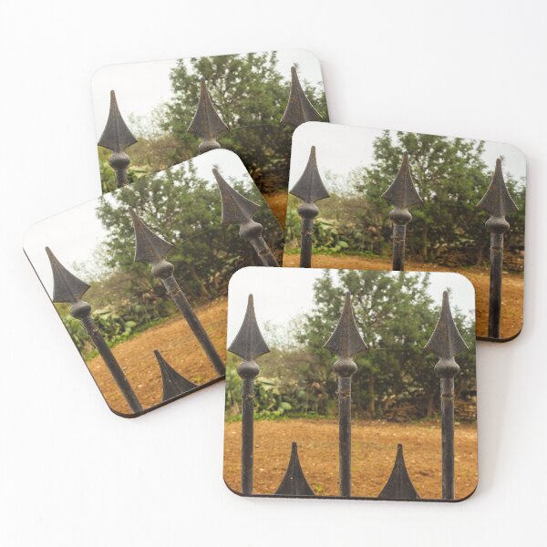 Item preview, Rusty Iron Fence Spikes In Front Of A Garden Yard With Greenery Background designed and sold by Nmallia.