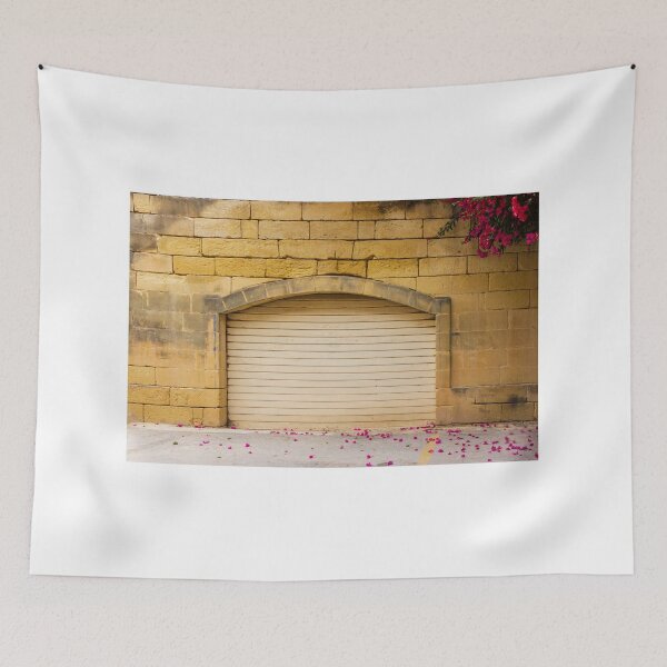 Item preview, Warm Yellow Stone Wall Archway With Closed Garage Door, Bougainvillea Blooms And Pink Petals designed and sold by Nmallia.